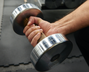 Man holding dumbbell